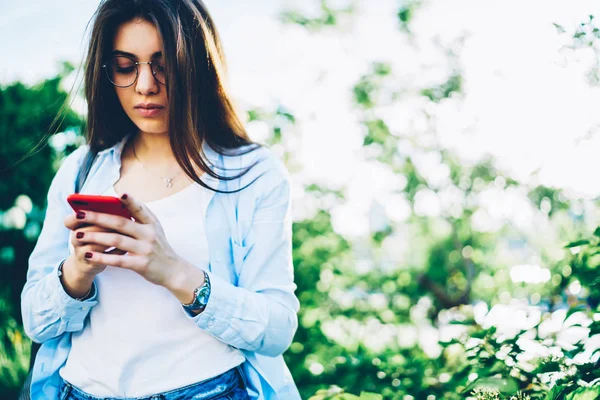 Pensive Female Blogger Optical Spectacles Uploading Photos Social Networks Mobile — Stock Photo, Image