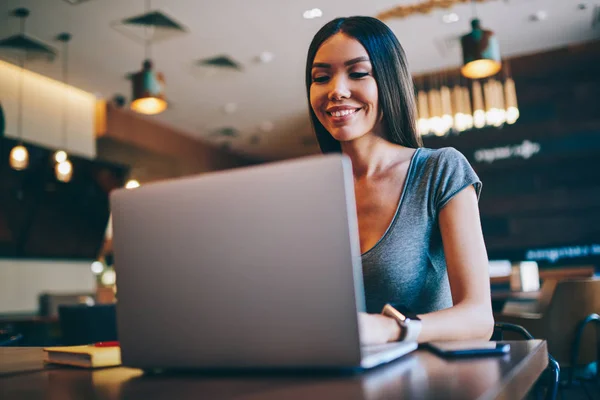 Positive Brunette Asian Student Reading Information Learning Online Courses Laptop — Stock Photo, Image