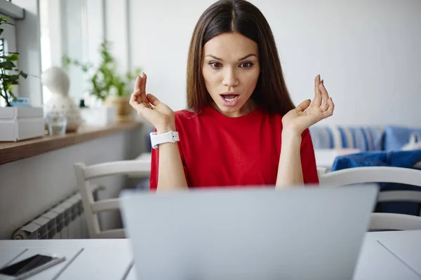 Stressed young woman shocked with fail of software during update on laptop computer,impressed hipster girl getting bad surprise with receipt for internet connection while checking mail on netboo