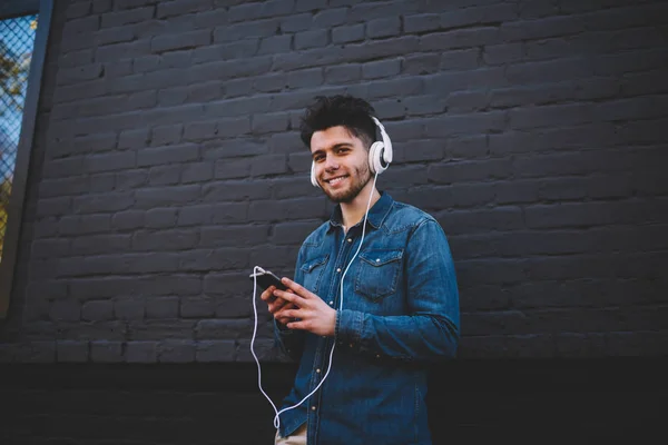 Positive Hipster Guy Chatting Social Networks While Listening Music Headphones — Stock Photo, Image