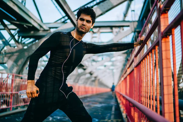 Professional Sportsman Dressed Tracksuit Warming Holding Bottle Hands While Listening — Stock Photo, Image