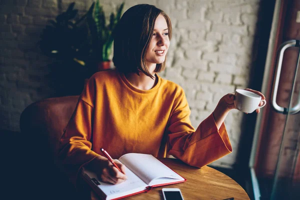 Thoughtful Young Woman Short Haircut Writing List Goals Diary Cafe — Stock Photo, Image