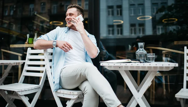 Side View Happy Casual Millennial Man Sitting White Table Street — Stock Photo, Image