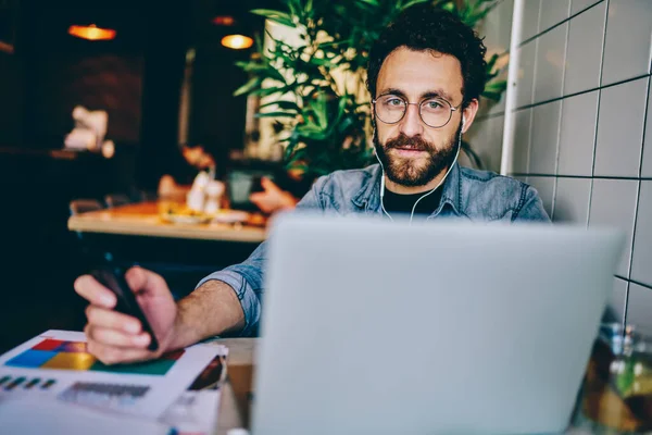 Portrait Bearded Young Man Freelancer Checking Email Mobile Phone While — Stock Photo, Image