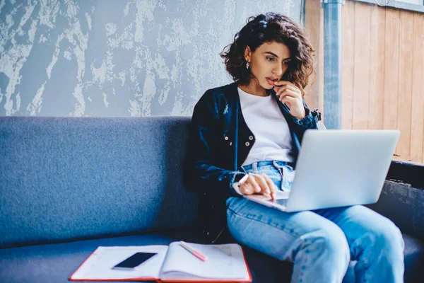 Pensive Female Freelancer Checking Email Reading Notification Sitting Gauč Modern — Stock fotografie