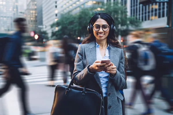 Satisfied Young Brunette Ethnic Woman Earphones Spectacles Gray Coat Black — Stock Photo, Image