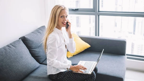 Side View Smiling Young Woman Shirt Sitting Couch Talking Smartphone — Stock Photo, Image