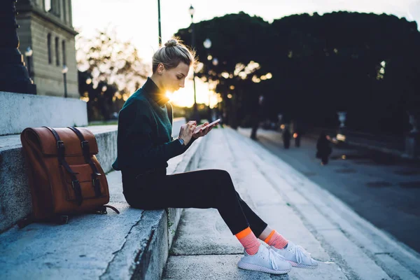 Side View Millennial Hipster Girl Using Mobile Phone Device Online — Stockfoto