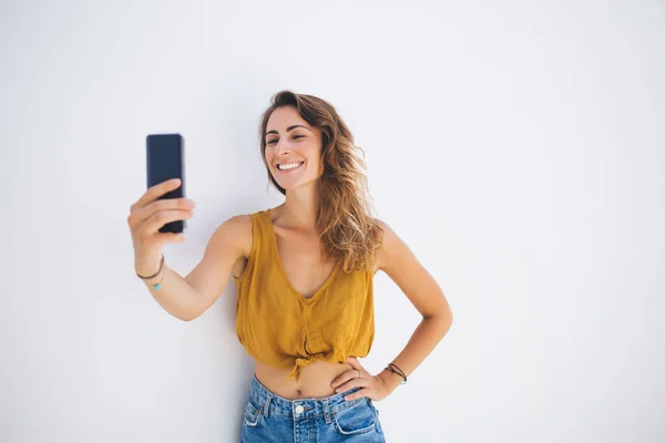 Happy Cheerful Young Woman Radiant Smile Crop Top Holding Smartphone — Stock Photo, Image