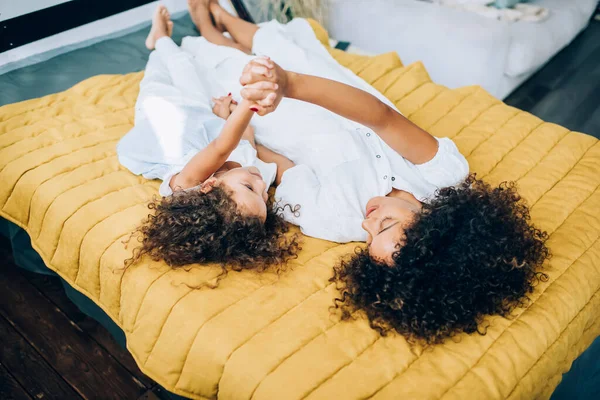 Happy Mother Alike Daughter Having Curly Hair Lying Together Bed — Stock Photo, Image