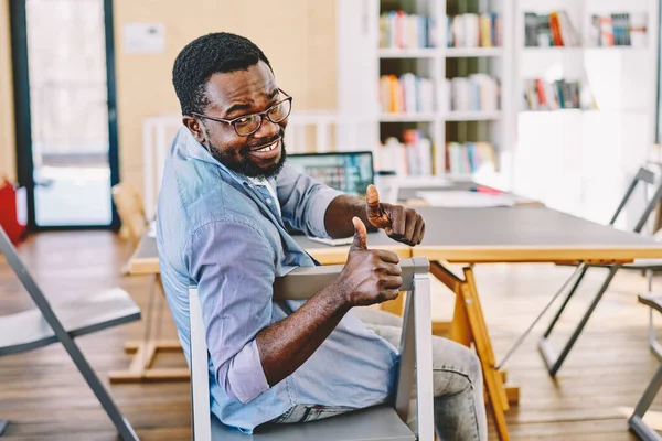 Adult African American Man Sitting Chair Turning Camera Smiling While — Stock Photo, Image