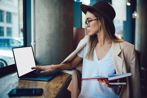 Stylish Young Woman Hat Glasses Holding Open Notepad Pushing Button — Stock Photo, Image