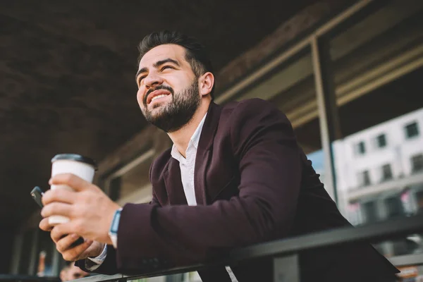 Low Angle Hispanic Boss Drink Modern Smartphone Looking Away Smiling — Stock Photo, Image