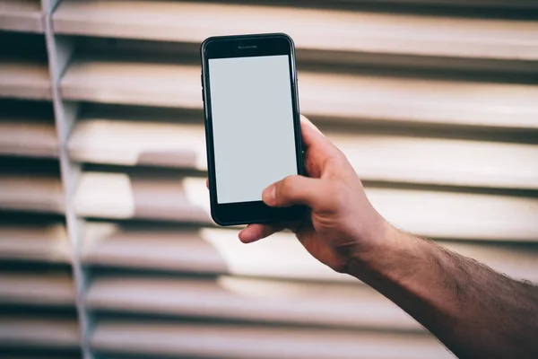 Crop Male Demonstrating Blank Screen While Using Smartphone Interest Blurred — Stock Photo, Image