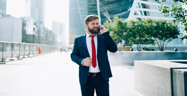 Thoughtful Bearded Man Dark Elegant Suit Red Tie Attentively Listening — Stock Photo, Image