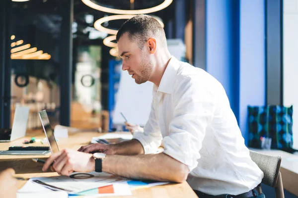 Side View Smart Attentive Man Sitting Table Contemporary Office While — Stock Photo, Image