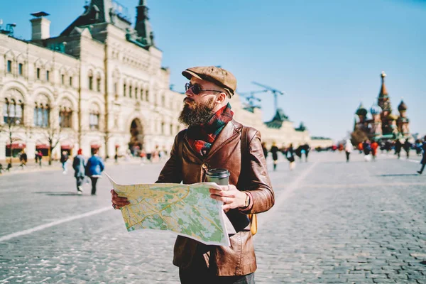 Bearded Man Leather Cap Jacket Orienting Tourist Map Sightseeing While — Stock Photo, Image