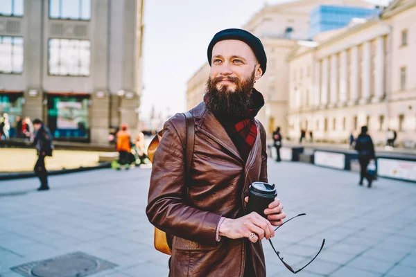 Cheerful Bearded Male Removing Sunglasses Black Cap Dressed Brown Leather — Stock Photo, Image