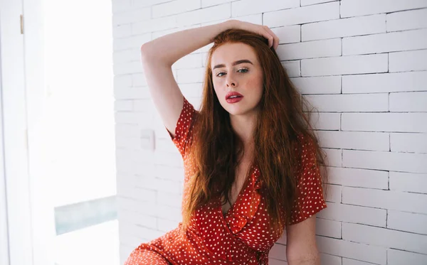 Pensive Red Haired Woman Red Polka Dot Dress Sitting Hand — Stock Photo, Image
