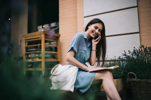 Side View Optimistic Young Woman Notebook Smiling Looking Camera While — Stock Photo, Image