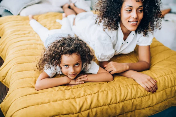 Ethnic Bright Curly Haired Mother Casual Clothes Relaxing Bed Dreaming — Stock Photo, Image