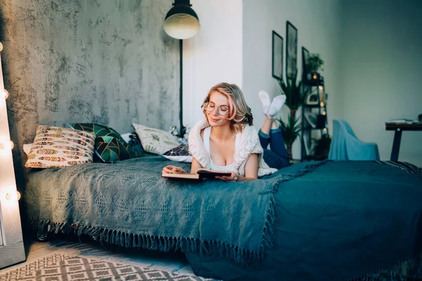 Knowledgeable Hipster Girl Optical Spectacles Vision Correction Lying Comfortable Bed — Stock Photo, Image