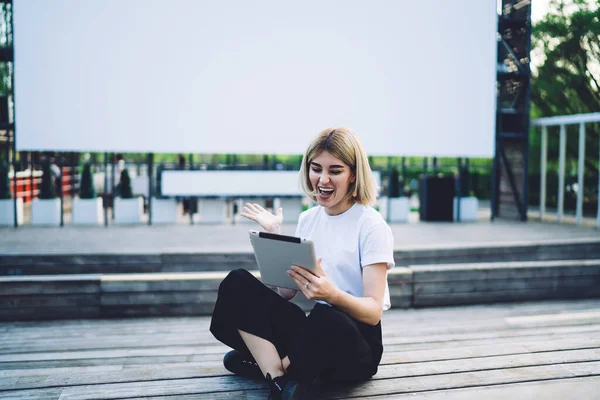 Cheerful Adult Modern Female Casual Outfit Browsing Tablet While Sitting — Stock Photo, Image