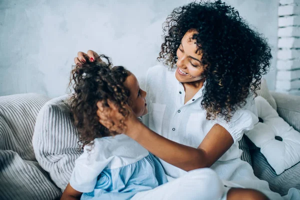 Ethnic Cheerful Woman Touching Curly Hair Pretty Little Daughter Relaxation — Stock Photo, Image