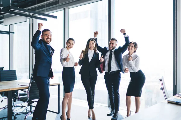 Company Successful Excited Colleagues Elegant Black Suits Standing Office Raised — Stock Photo, Image