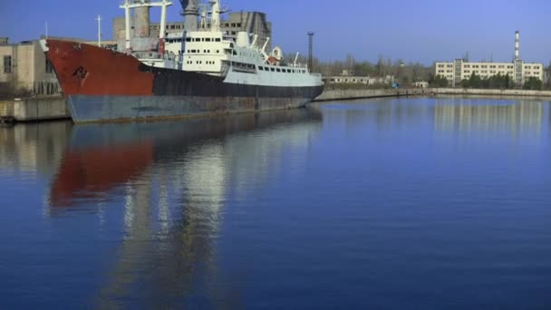 Cargo ship on river vessel Shipbuilding plant city industry Construction crane — Stock Video