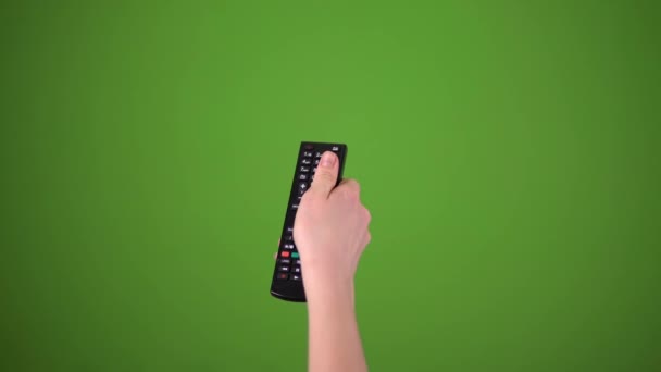 Television Remote Changing Channels On Green Screen — Stock Video