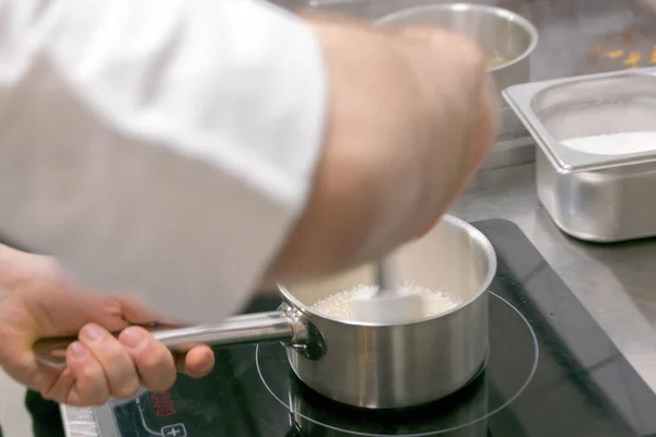 Cook Work Restaurant Kitchen While Turning Rice Induction Hob Royalty Free Stock Images