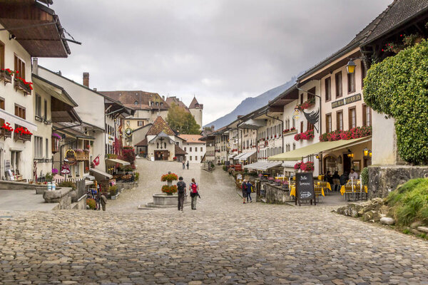 Le Gruyere / Fribourg, Switzerland - 02 October 2014: Beautiful view of the medieval town of Gruyeres, home to the world-famous Le Gruyere cheese, canton of Fribourg, Switzerland
