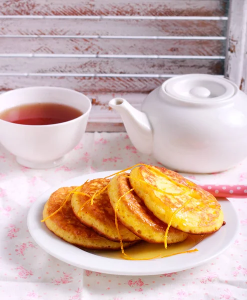 Orange pancakes on plate — Stock Photo, Image