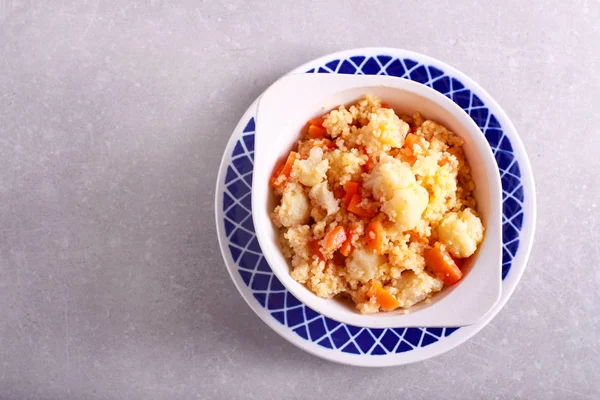 Cauliflower and carrot couscous in a bowl — Stock Photo, Image