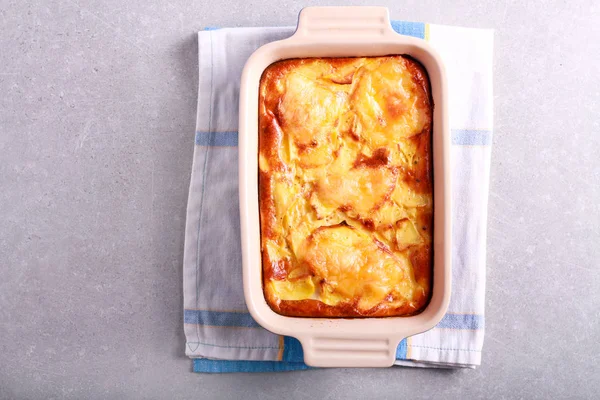 Gratin with baked cheese on top in a tin — Stock Photo, Image
