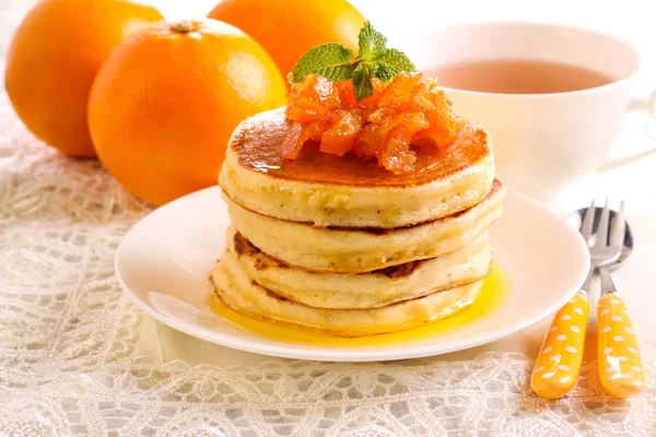 Orange pancakes with candied zest — Stock Photo, Image