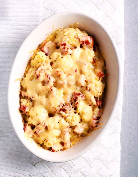 Cauliflower and ham cheese bake in a tin — Stock Photo, Image