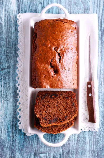 Date and chocolate cake loaf on plate — Stock Photo, Image