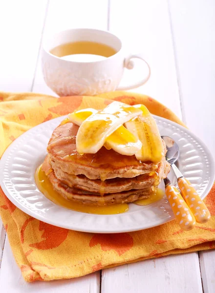 Oat  pancakes with banana and honey — Stock Photo, Image