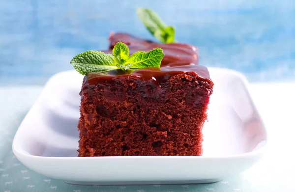 Cherry brownies with chocolate frosting — Stock Photo, Image