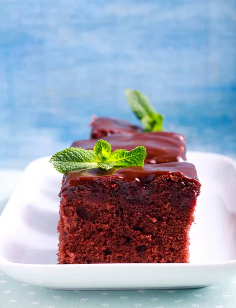 Cherry brownies with chocolate frosting — Stock Photo, Image