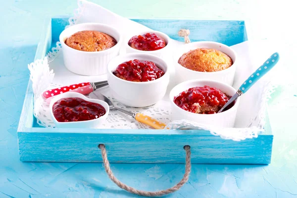 Coconut and raspberry puddings in ramekins — Stock Photo, Image