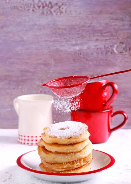 Apple fritters with powdered sugar