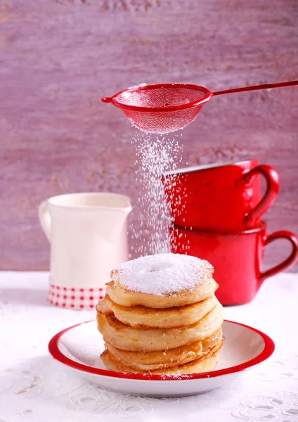 Apple fritters with powdered sugar