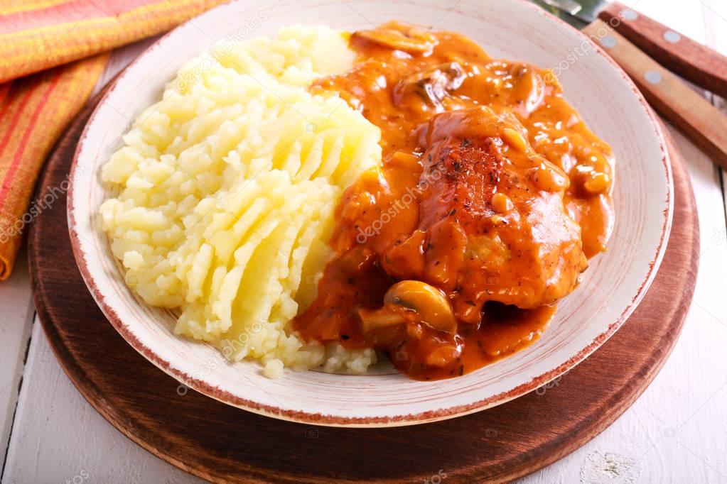 Chicken stew with gravy and mashed potatoes