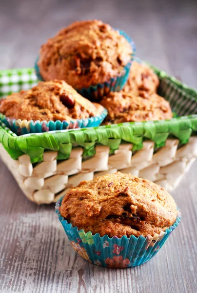 Date muffins in a basket — Stock Photo, Image