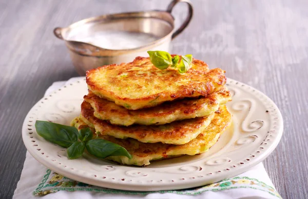 Stack of zucchini and feta fritters — Stock Photo, Image