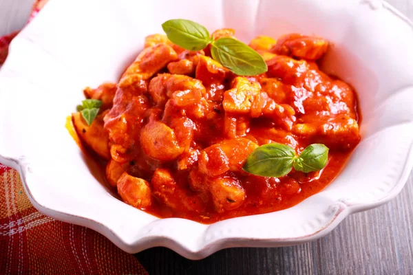 Chicken breast pieces in tomato sauce — Stock Photo, Image