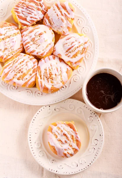 Pumpkin swirl buns with icing — Stock Photo, Image